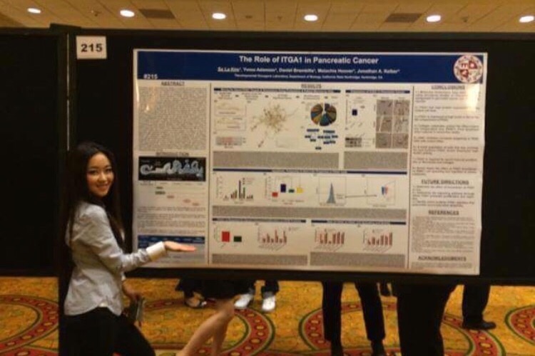 Sa La Kim, with an earlier poster presentation of her research